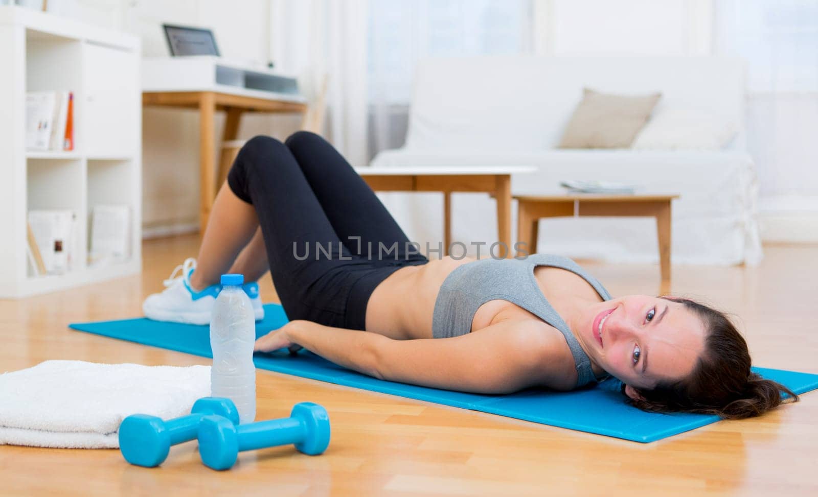 View of a Young attractive woman having a rest after sport
