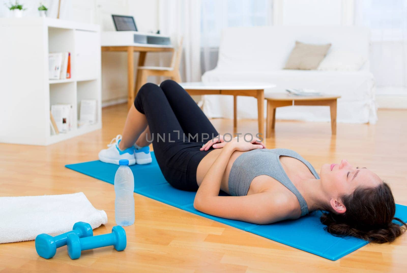 View of a Young attractive woman having a rest after sport