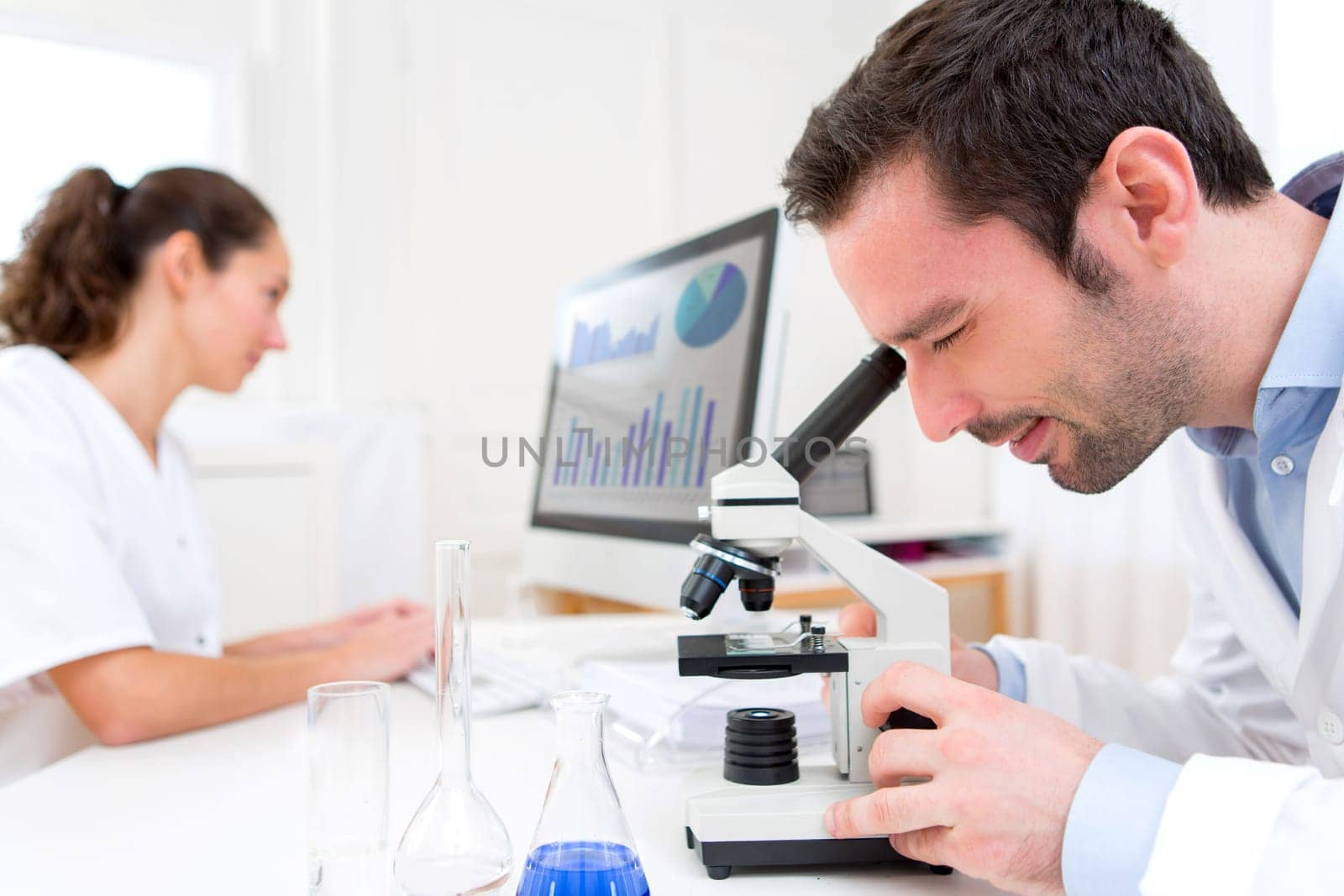 View of a Scientist and her assistant in a laboratory