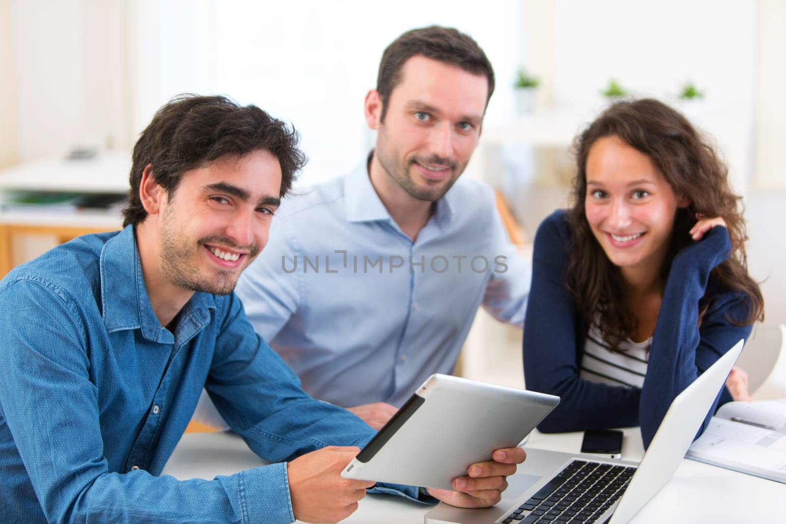 View of a Group of young active people working together