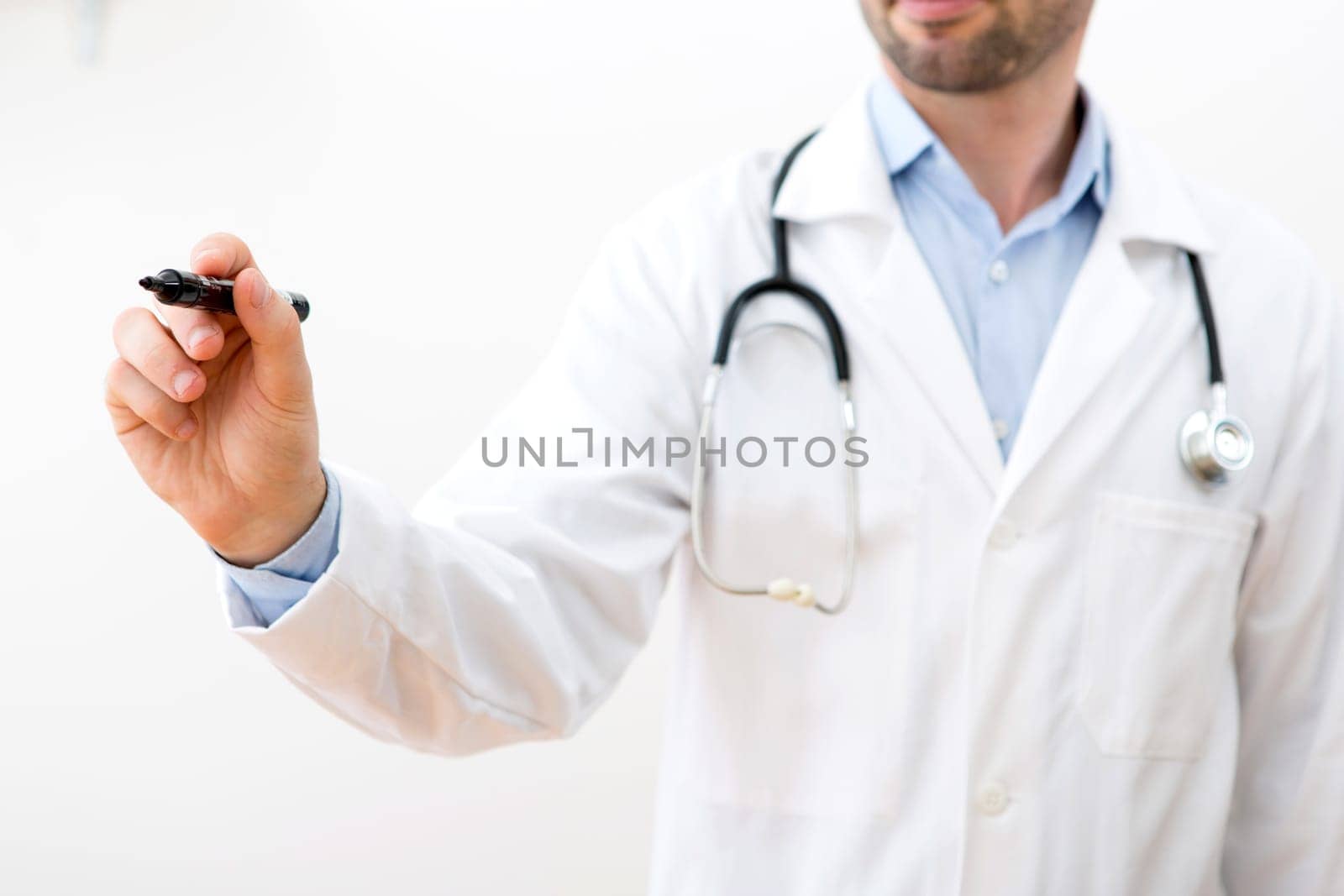View of a Professional doctor writing on a touchscreen interface