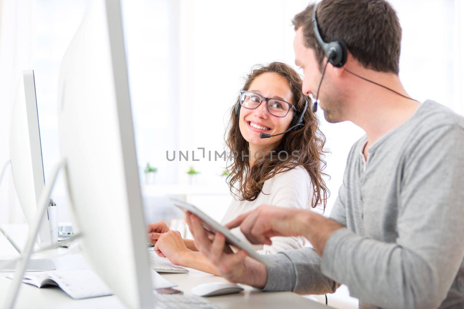 View of Co-workers on a call center having fun