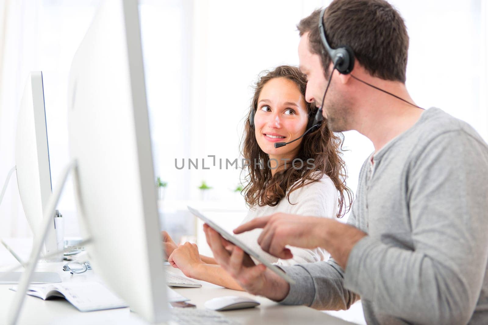 View of Co-workers on a call center having fun