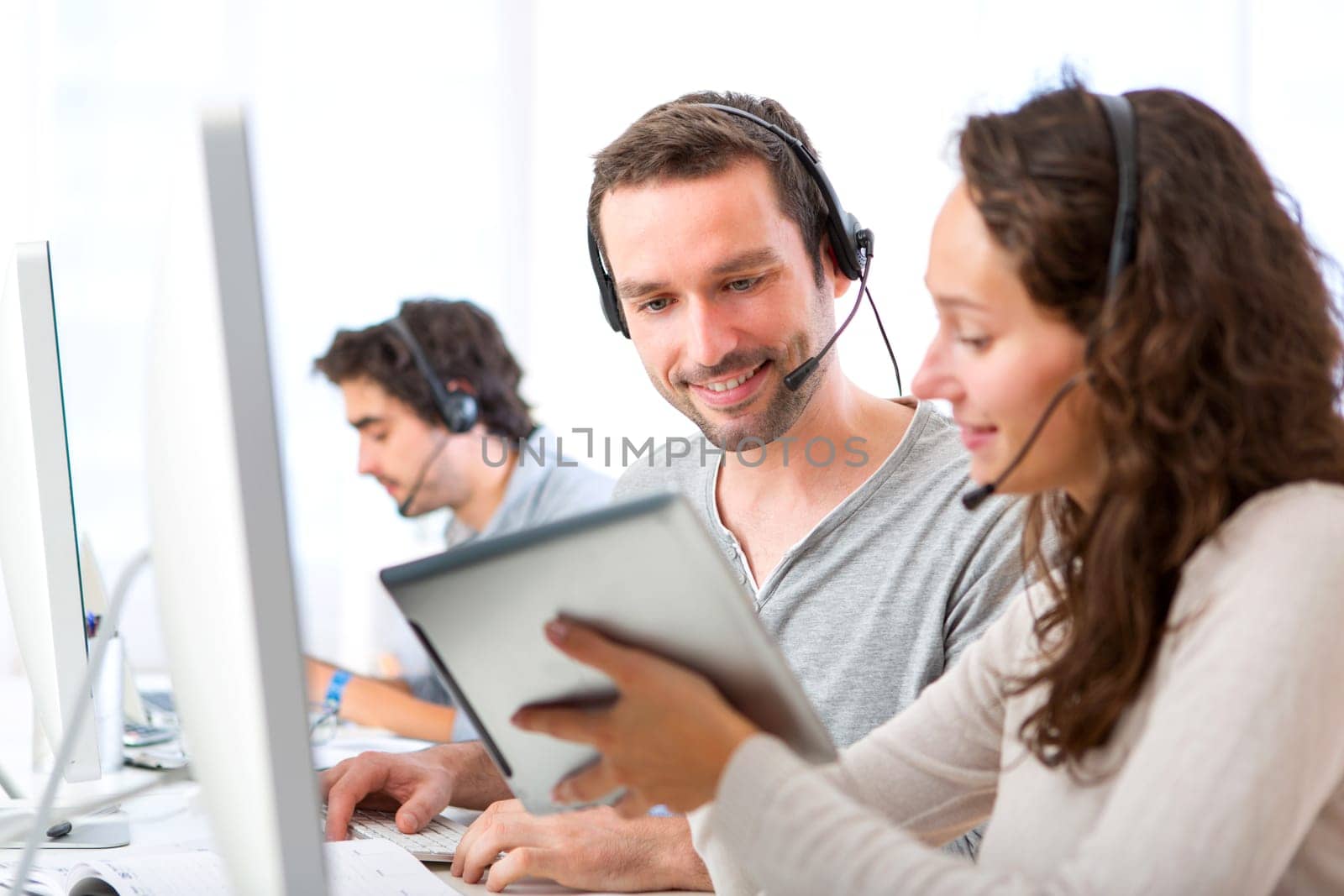View of a Young attractive woman working in a call center