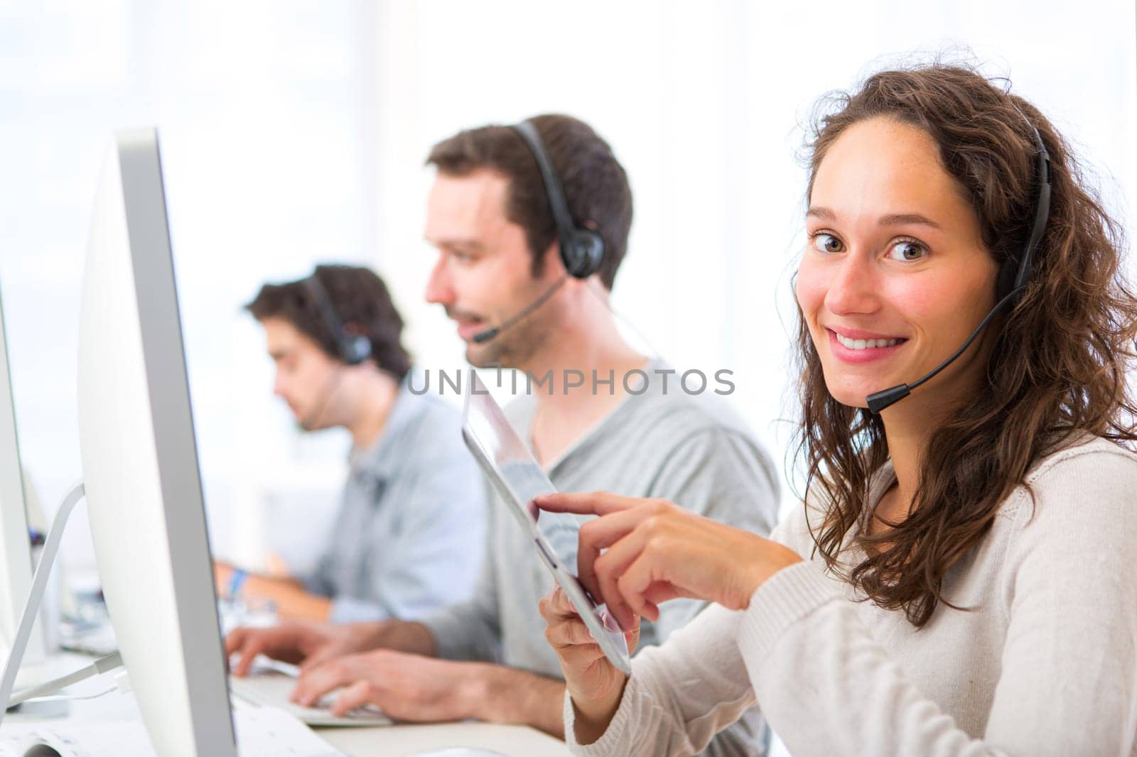 View of a Young attractive woman working in a call center