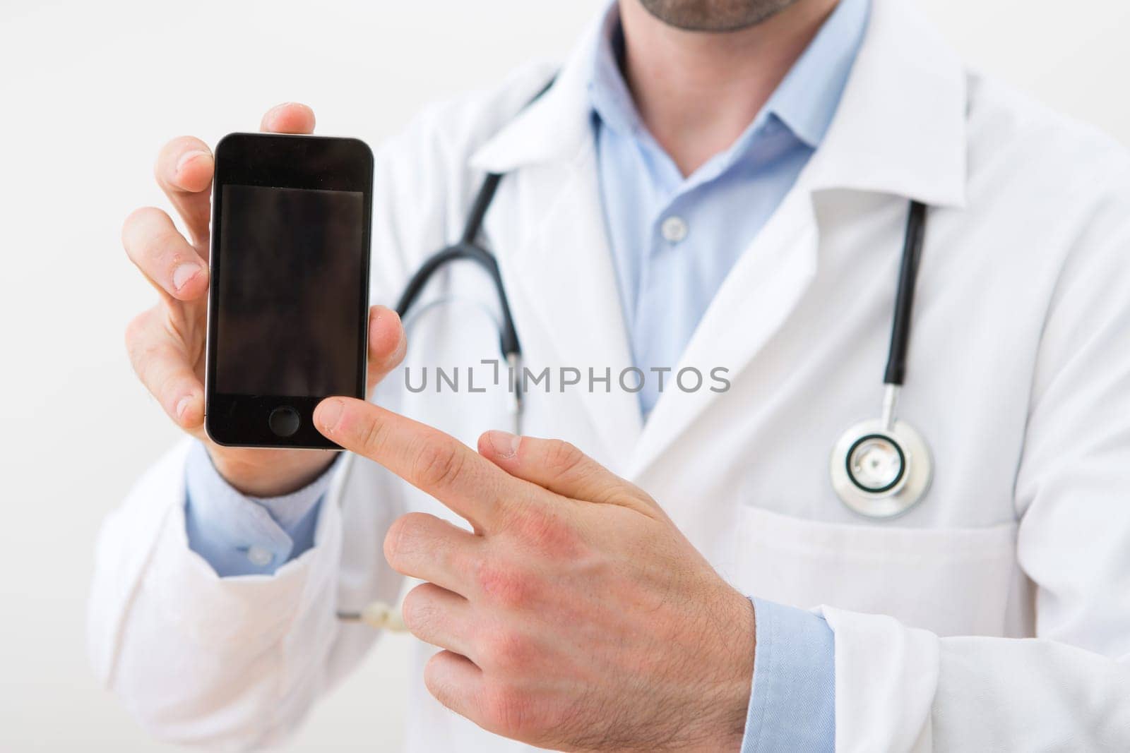 View of a Professional Doctor handing a smartphone