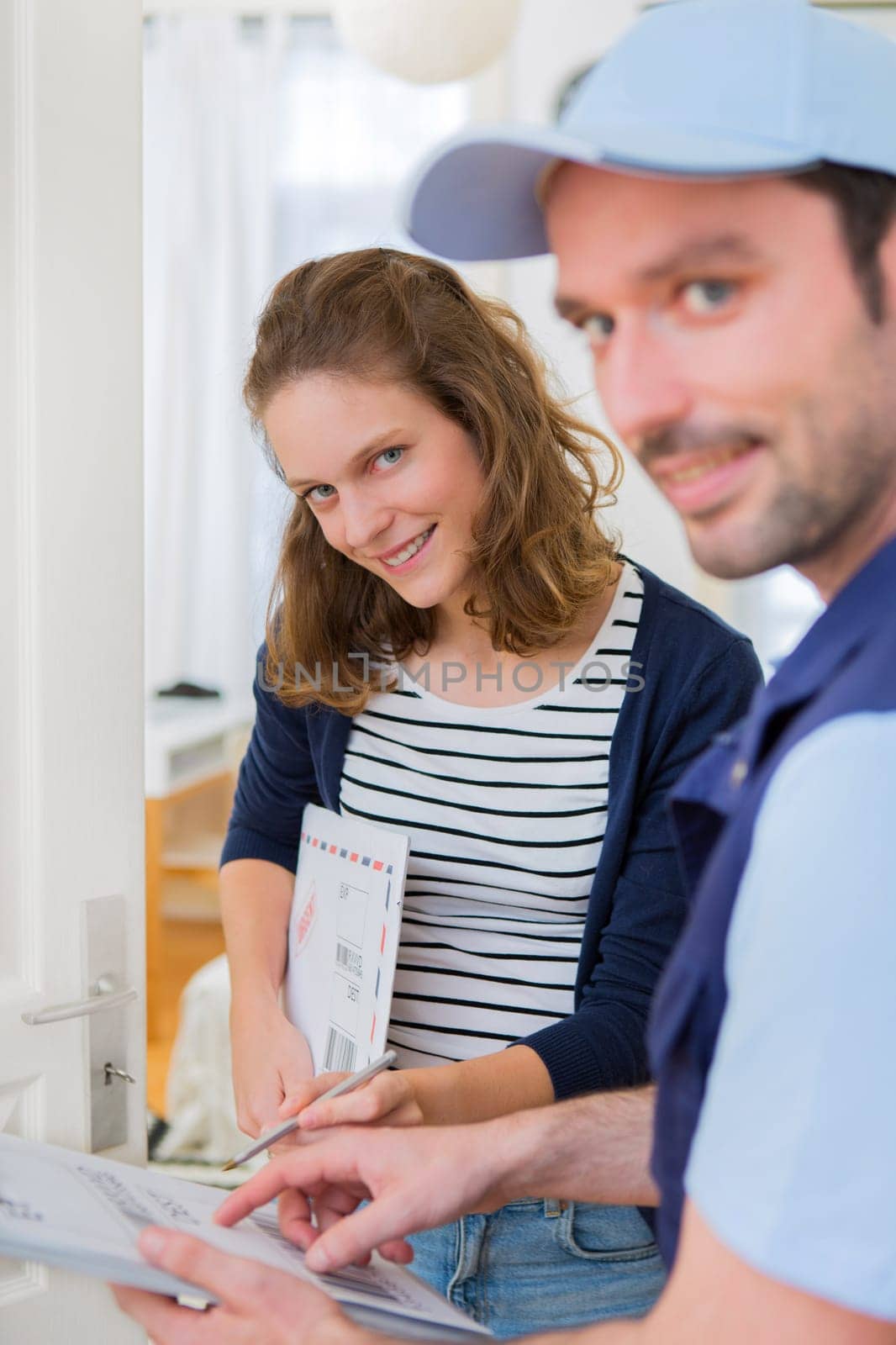 View of a Delivery man handing over a registered mail