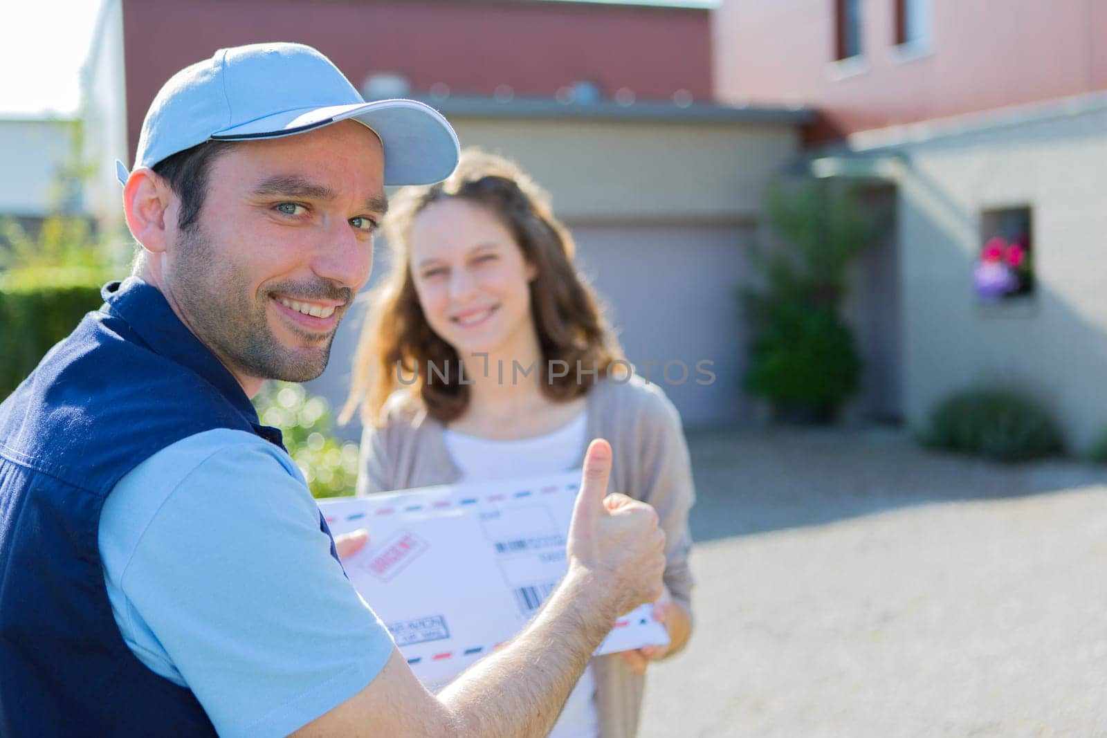 View of a Delivery man handing over a registered mail