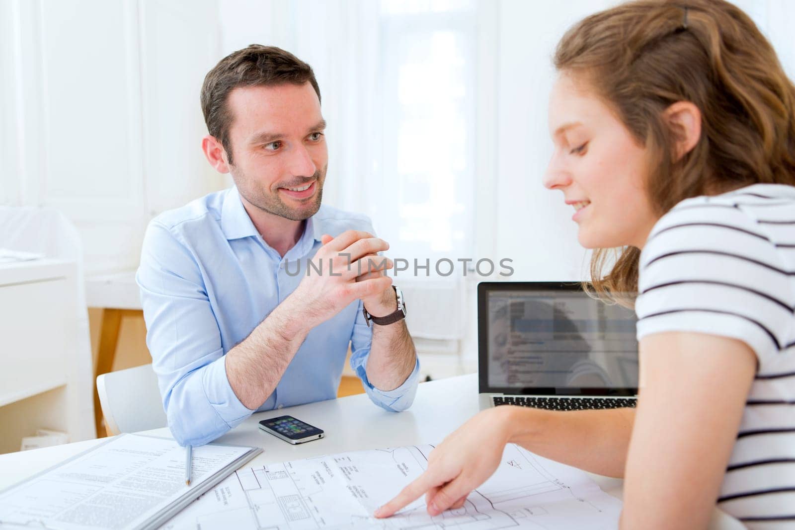 Real estate agent and customer at the office
