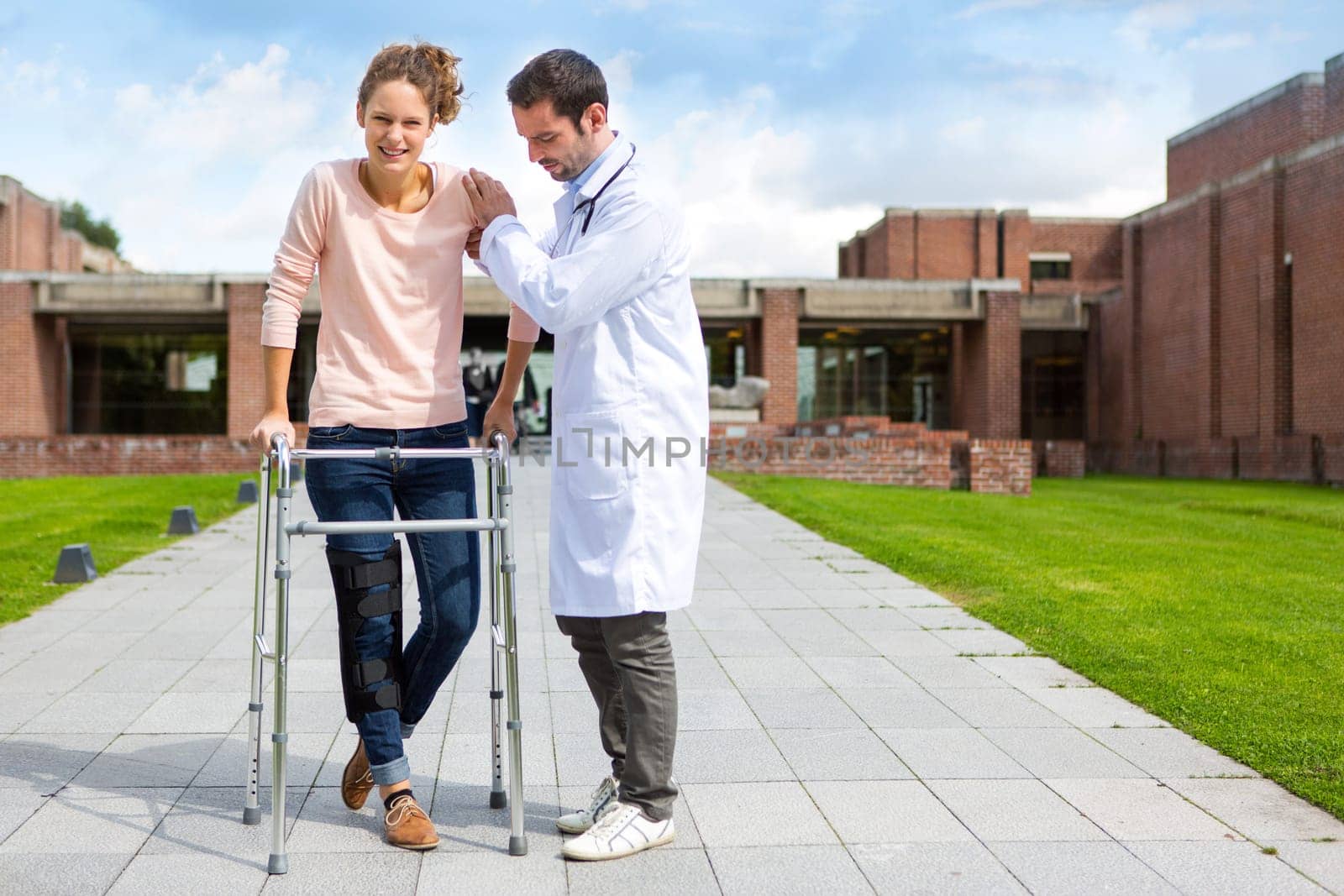 VIew of a Young doctor assisting a young woman