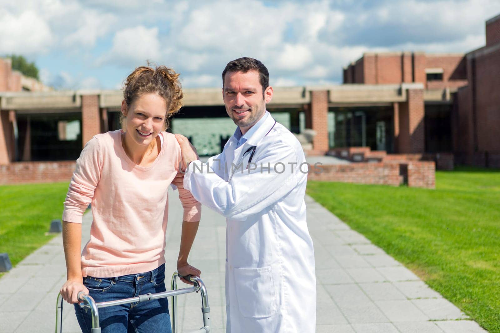 VIew of a Young doctor assisting a young woman