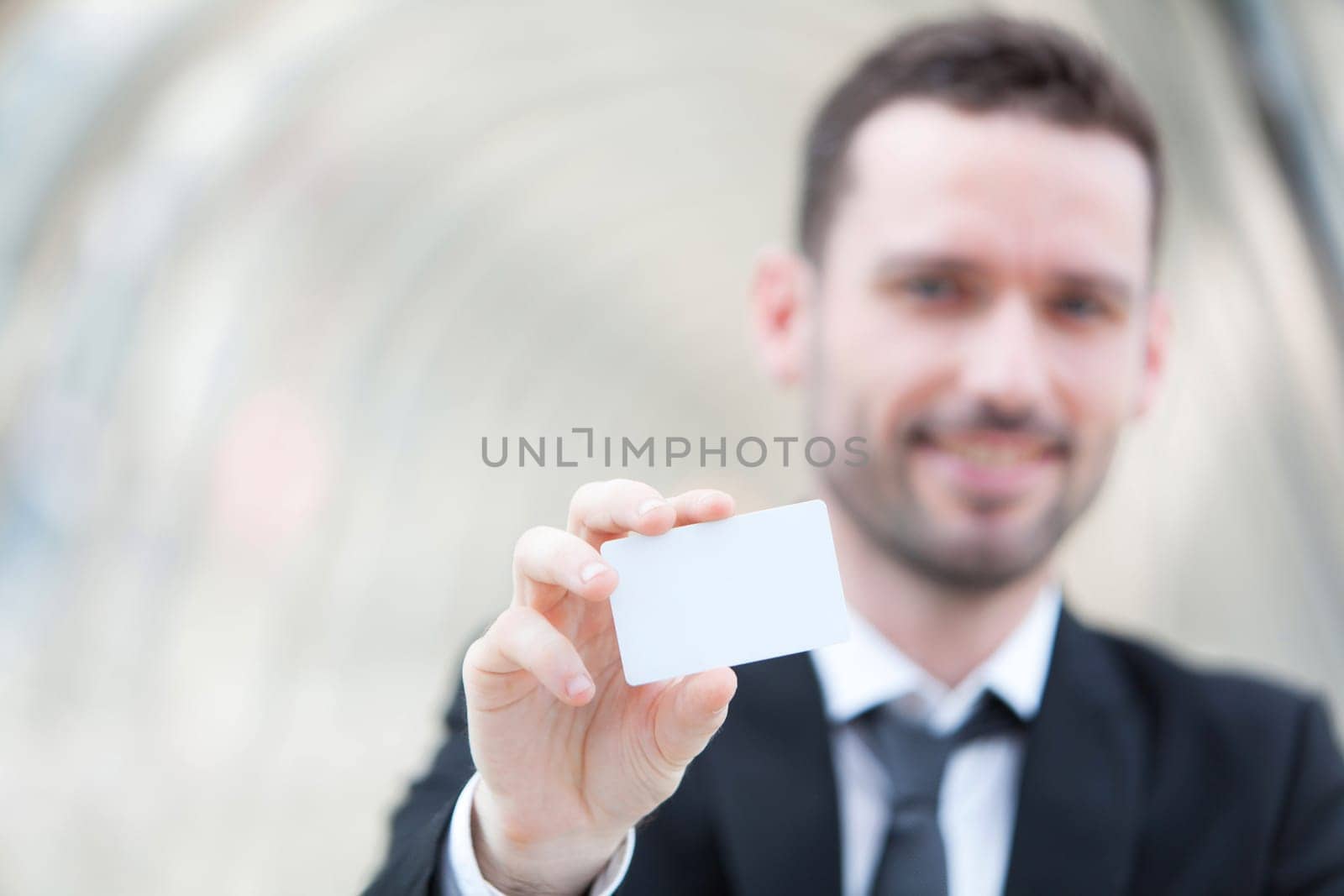 View of an Attractive businessman showing an empty textspace card