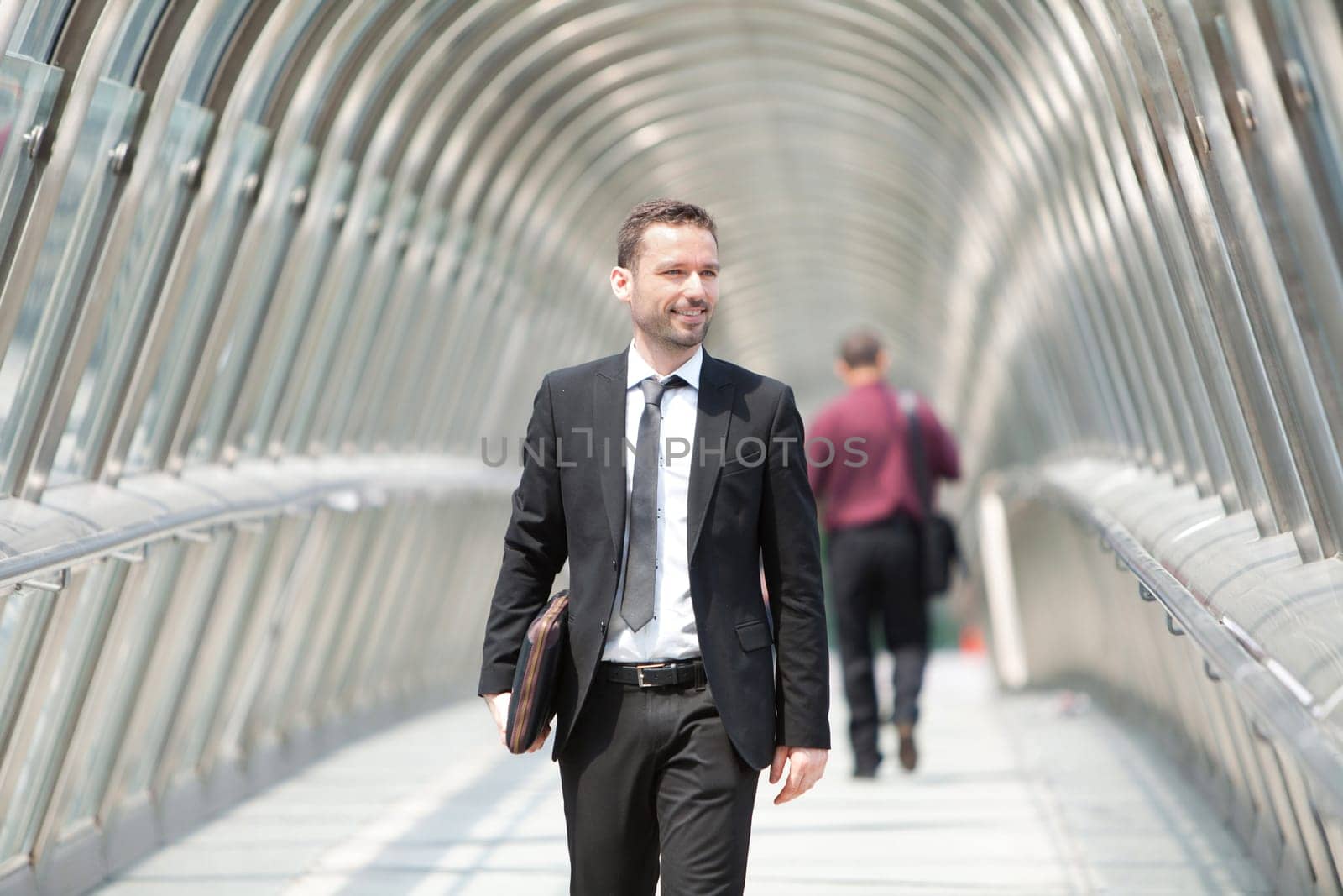View of a Young attractive businessman on the way to his job