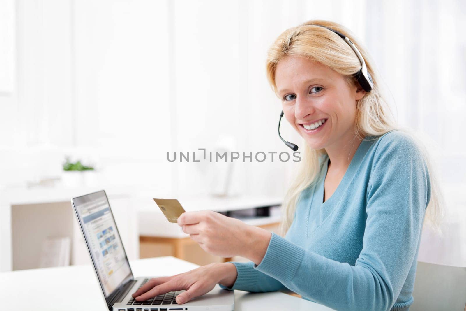 View of an Attractive blonde woman shopping online
