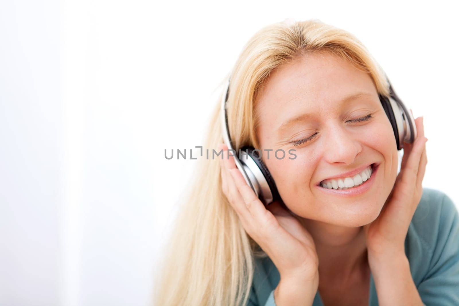 View of a young attractive woman listenning music