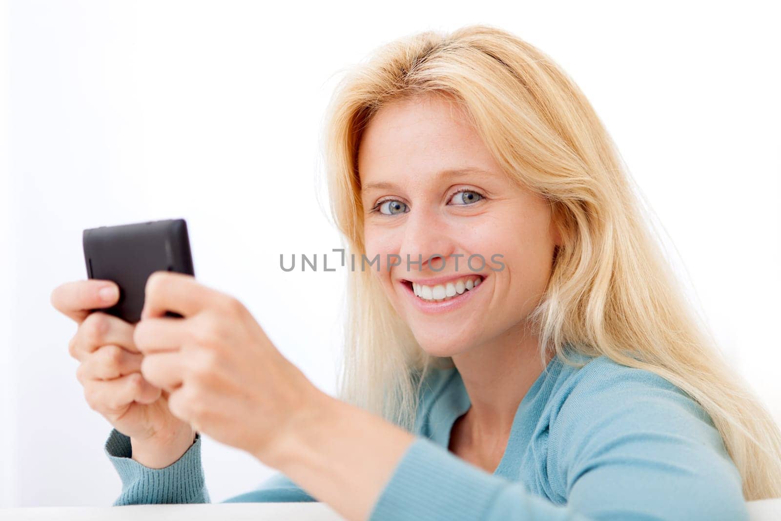View of Young relaxed woman sending text