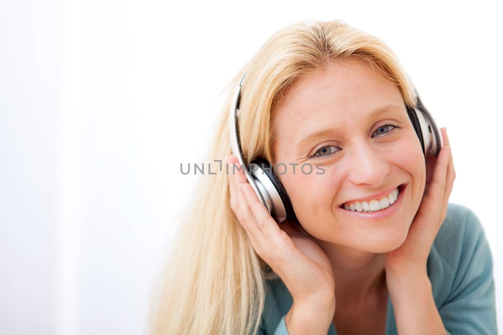 View of a young attractive woman listenning music