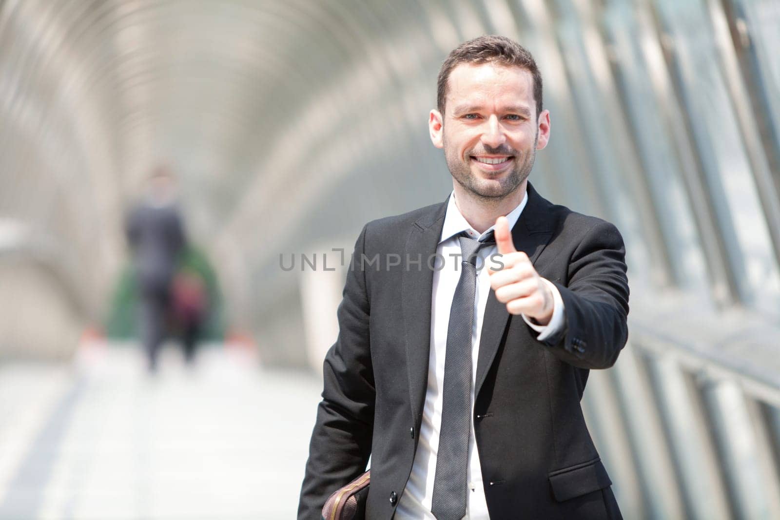 View of a Young attractive businessman on the way to his job