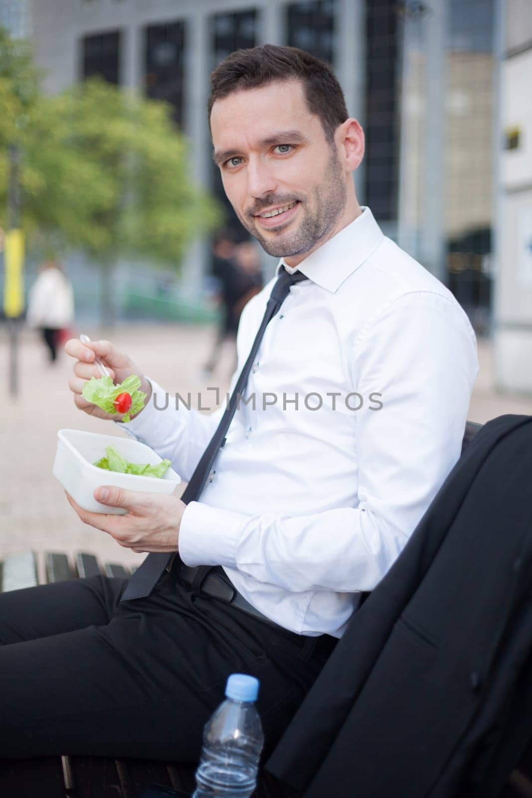 View of a Businessman eating salad for lunch break