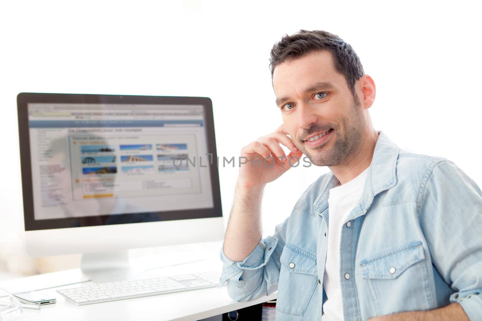 View of a young relaxed man using computer
