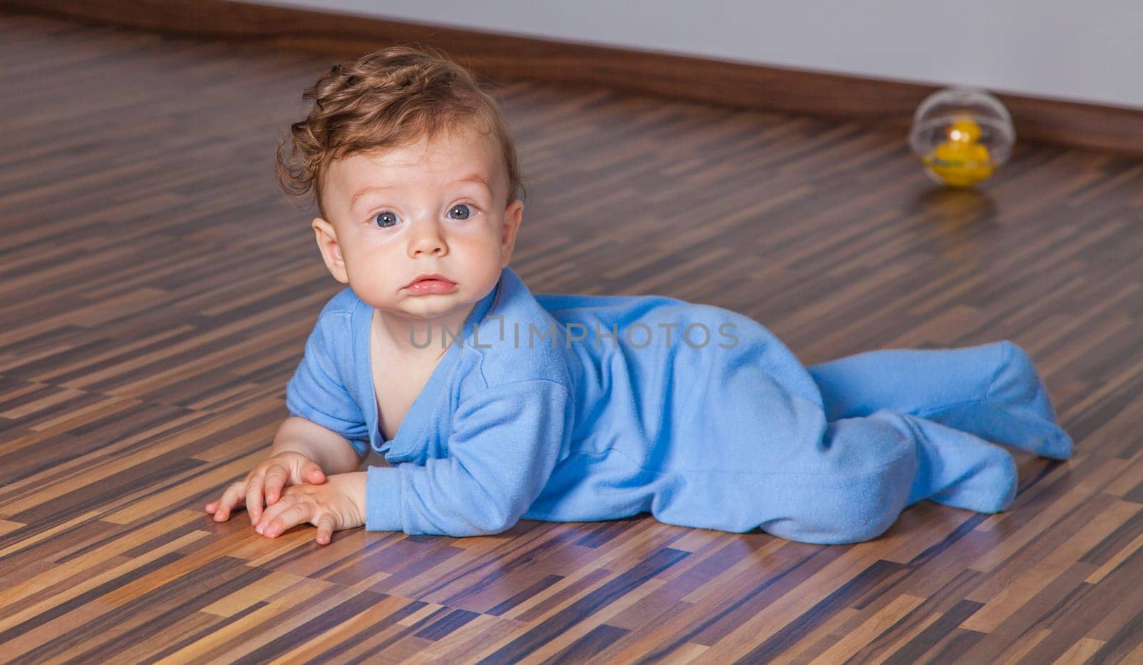 Portrait of a 7 months old baby boy at home.