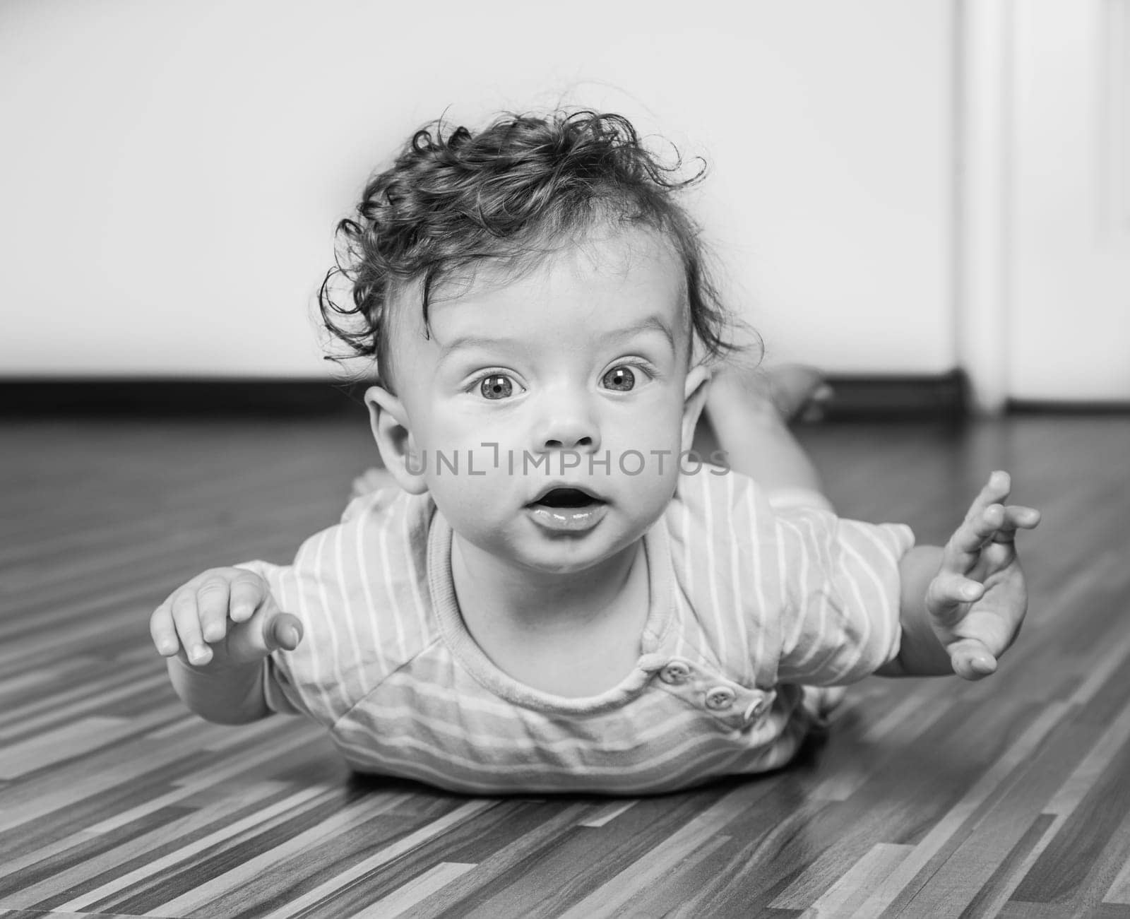Portrait of a 7 months old baby boy at home.