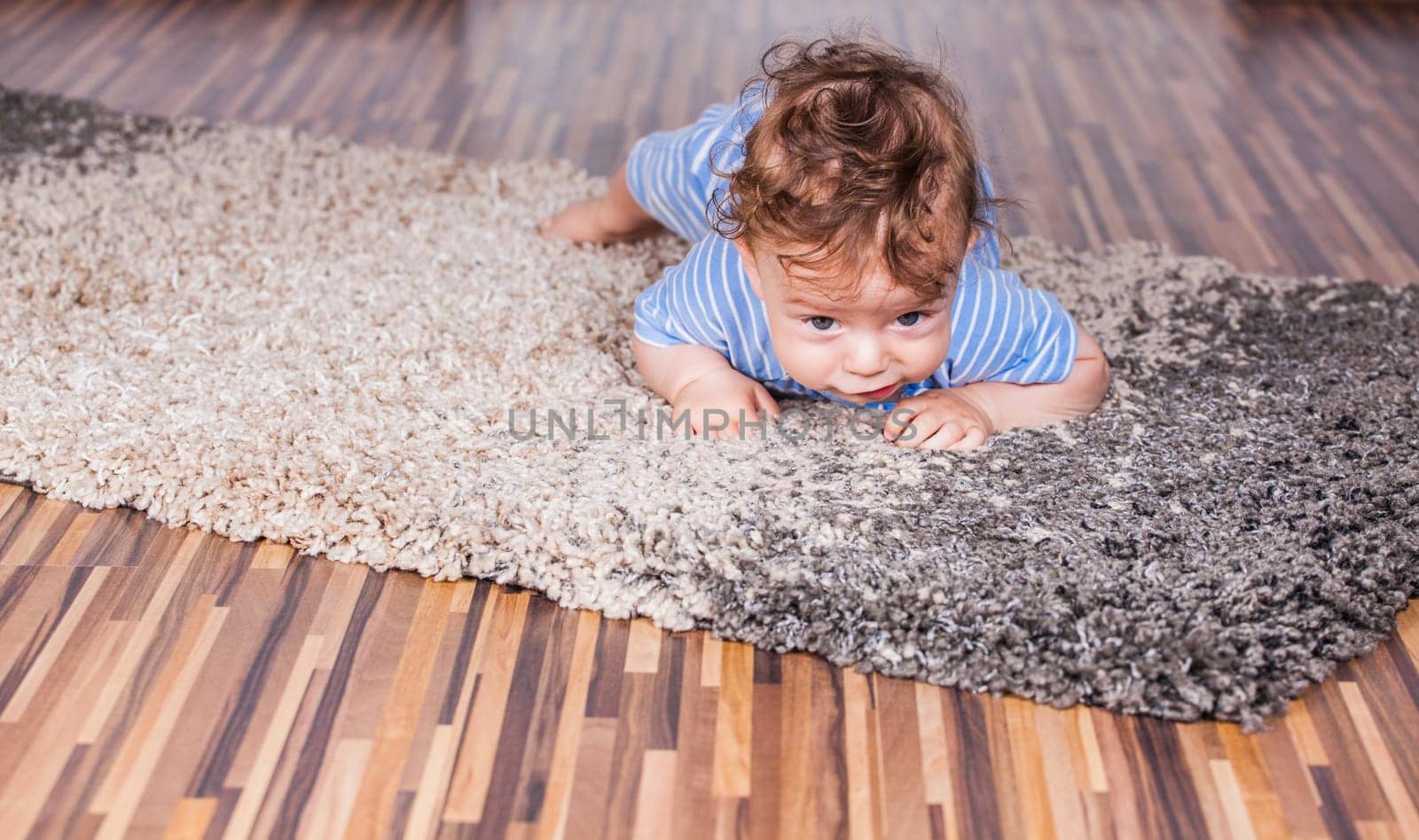 Portrait of a 7 months old baby boy at home.