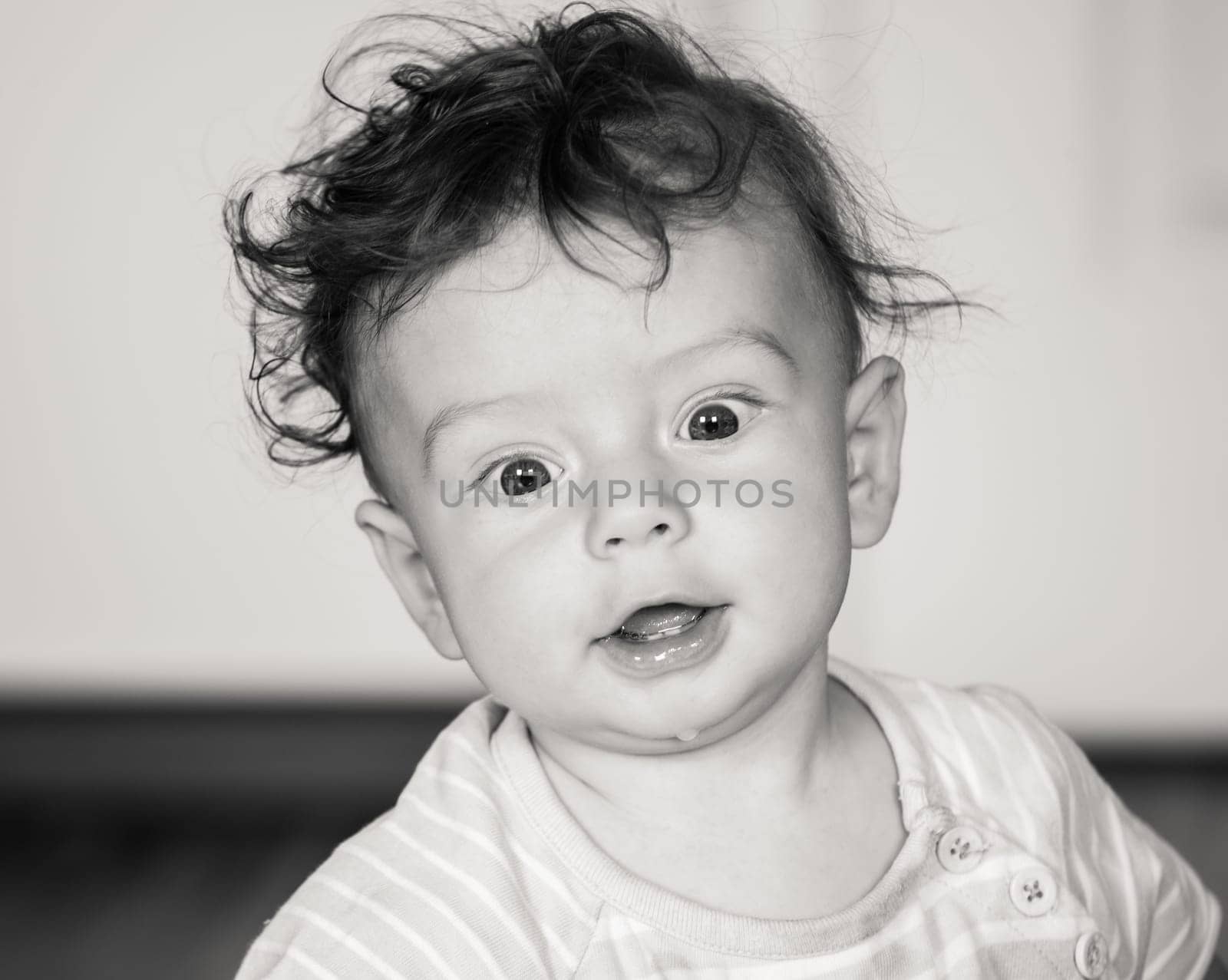 Portrait of a 7 months old baby boy at home.