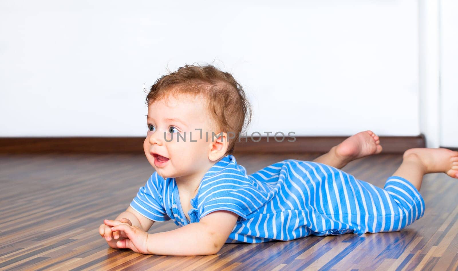 Portrait of a 7 months old baby boy at home.