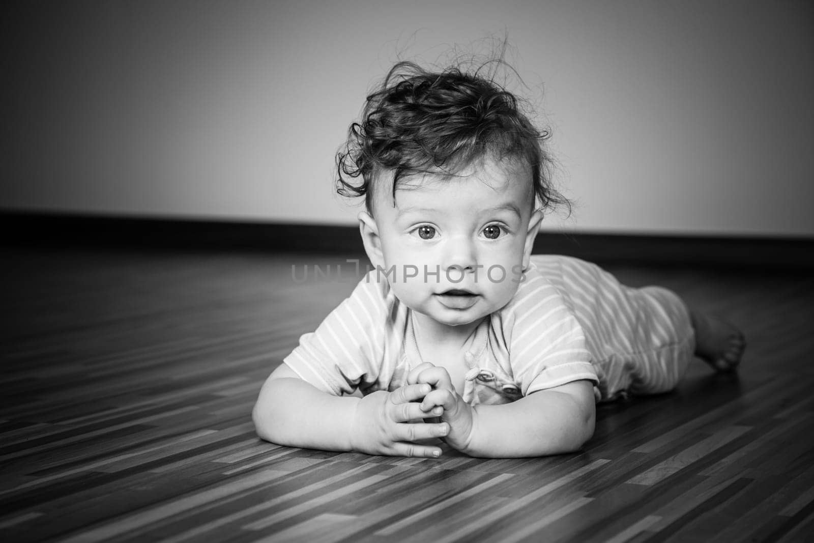 Portrait of a 7 months old baby boy at home.