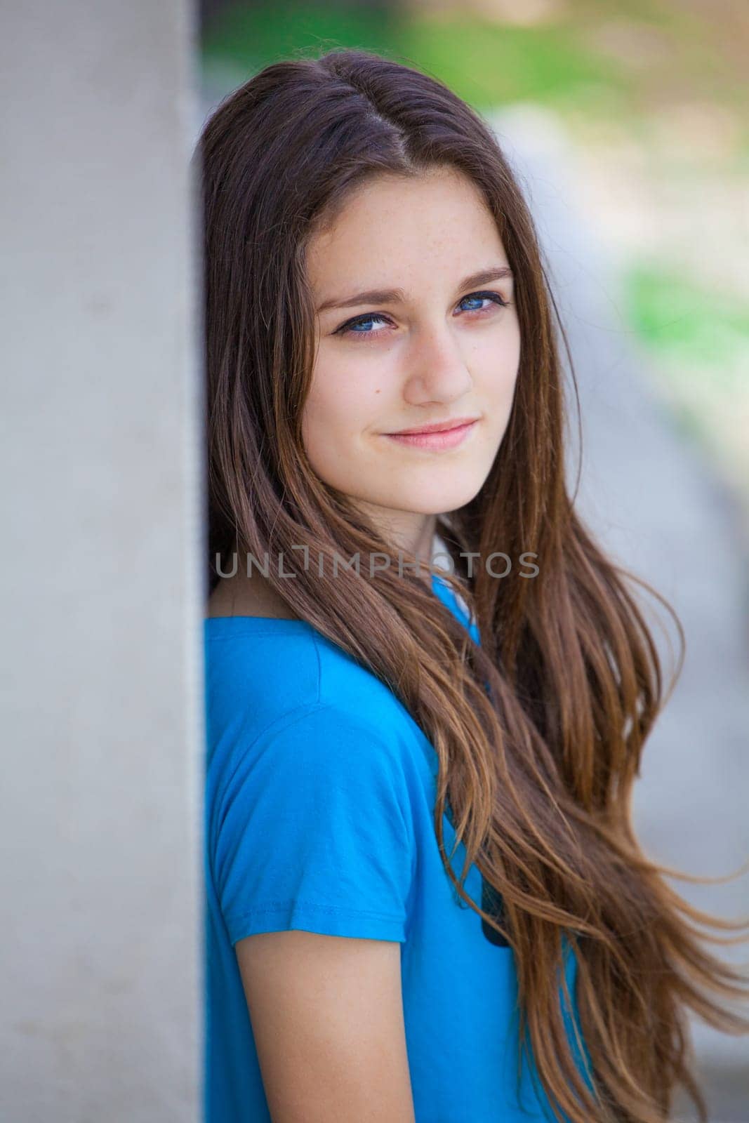 Outdoor portrait of beautiful teenage girl in spring.