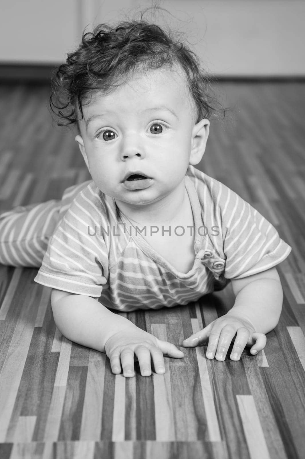 Portrait of a 7 months old baby boy at home.