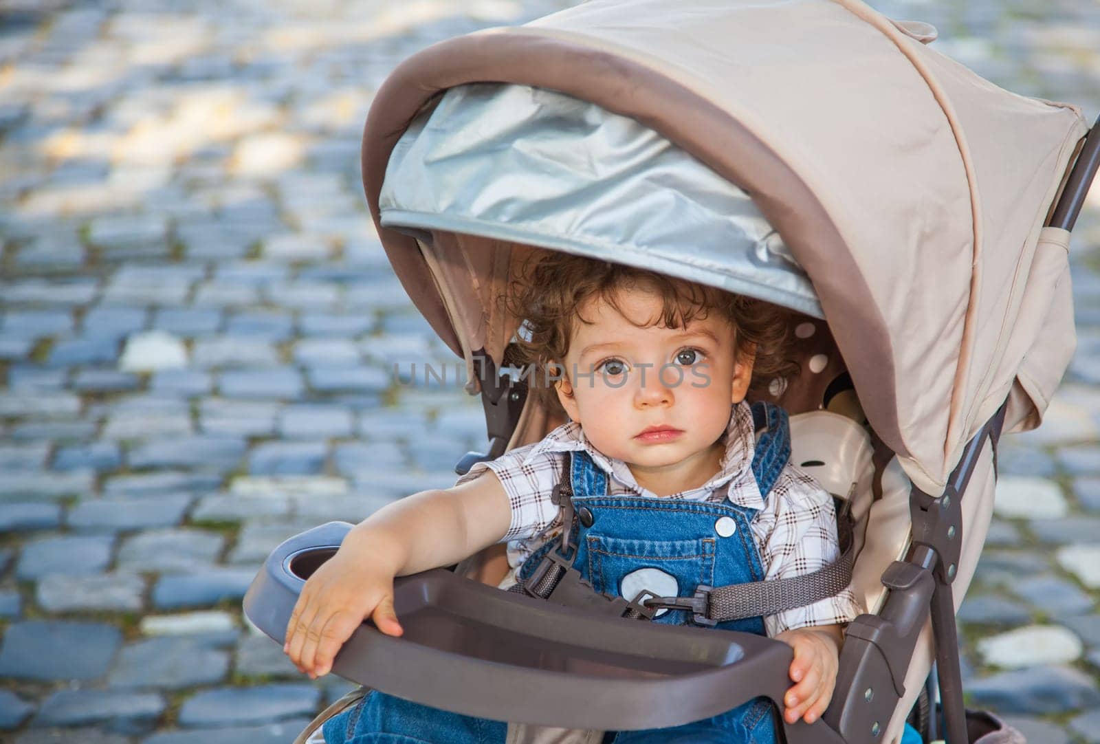 Portrait of 1 year old baby boy outdoor.