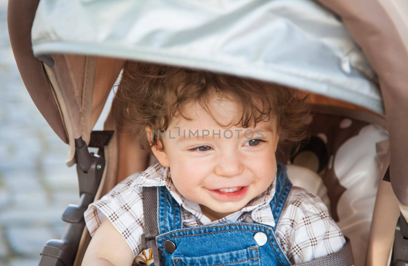 Portrait of 1 year old baby boy outdoor.