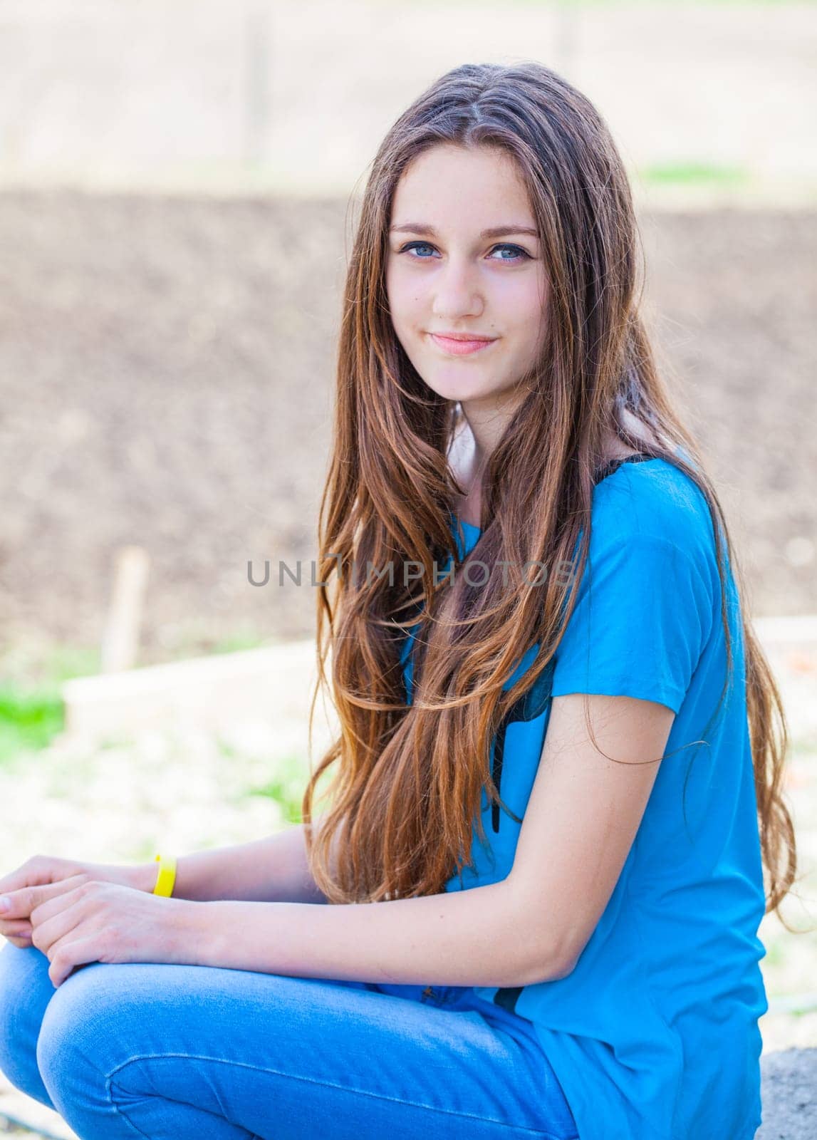 Outdoor portrait of beautiful teenage girl in spring.