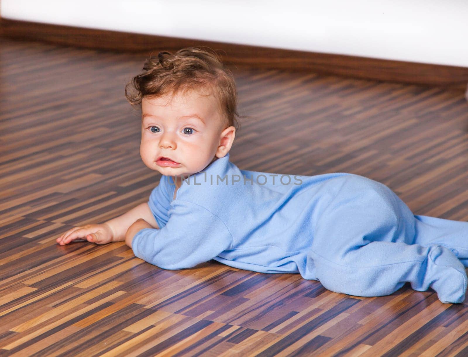 Portrait of a 7 months old baby boy at home.