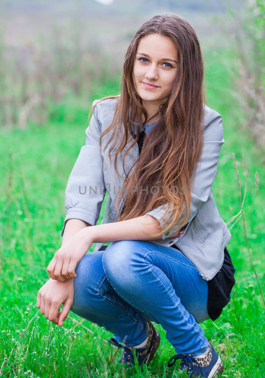 Outdoor portrait of beautiful teenage girl in spring.