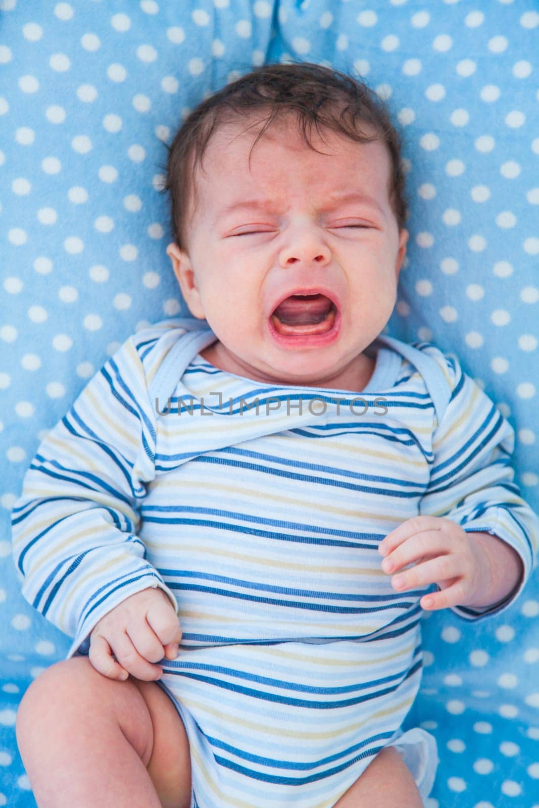 Portrait of a 2 months old baby boy at home.