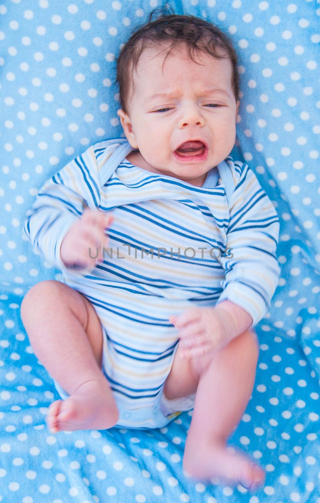 Portrait of a 2 months old baby boy at home.