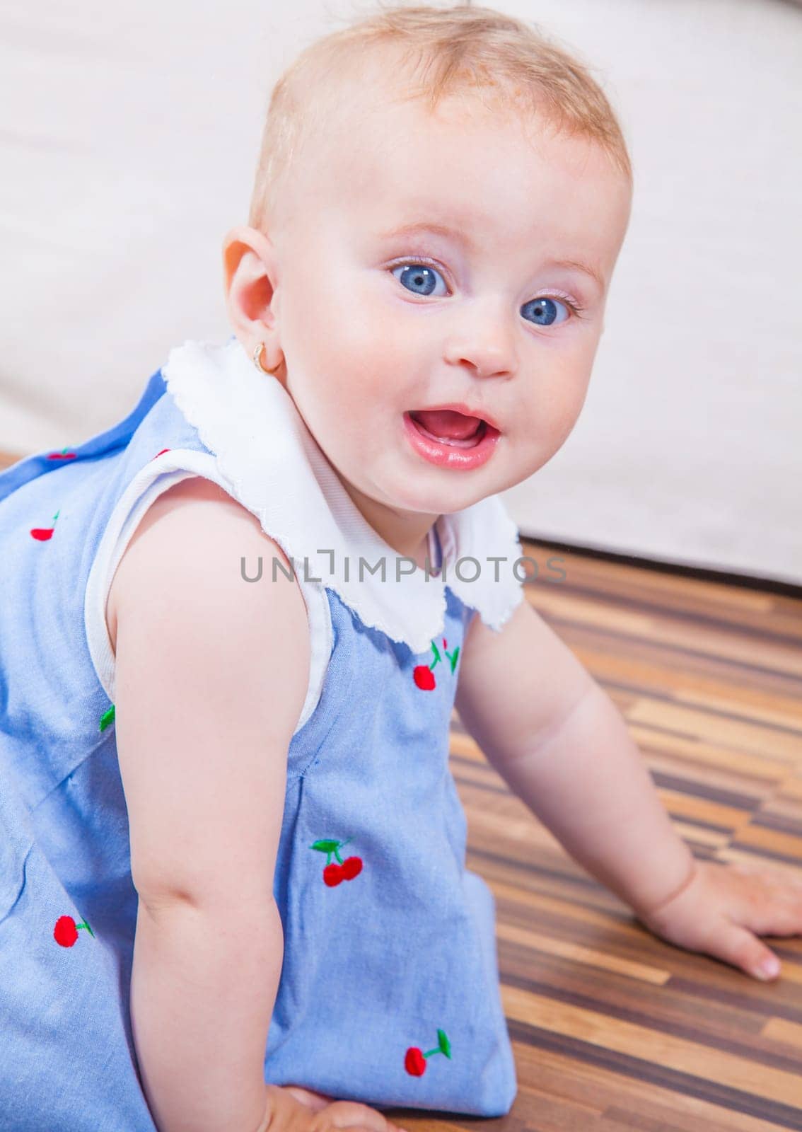 Portrait of 1 year old baby girl playing at home.