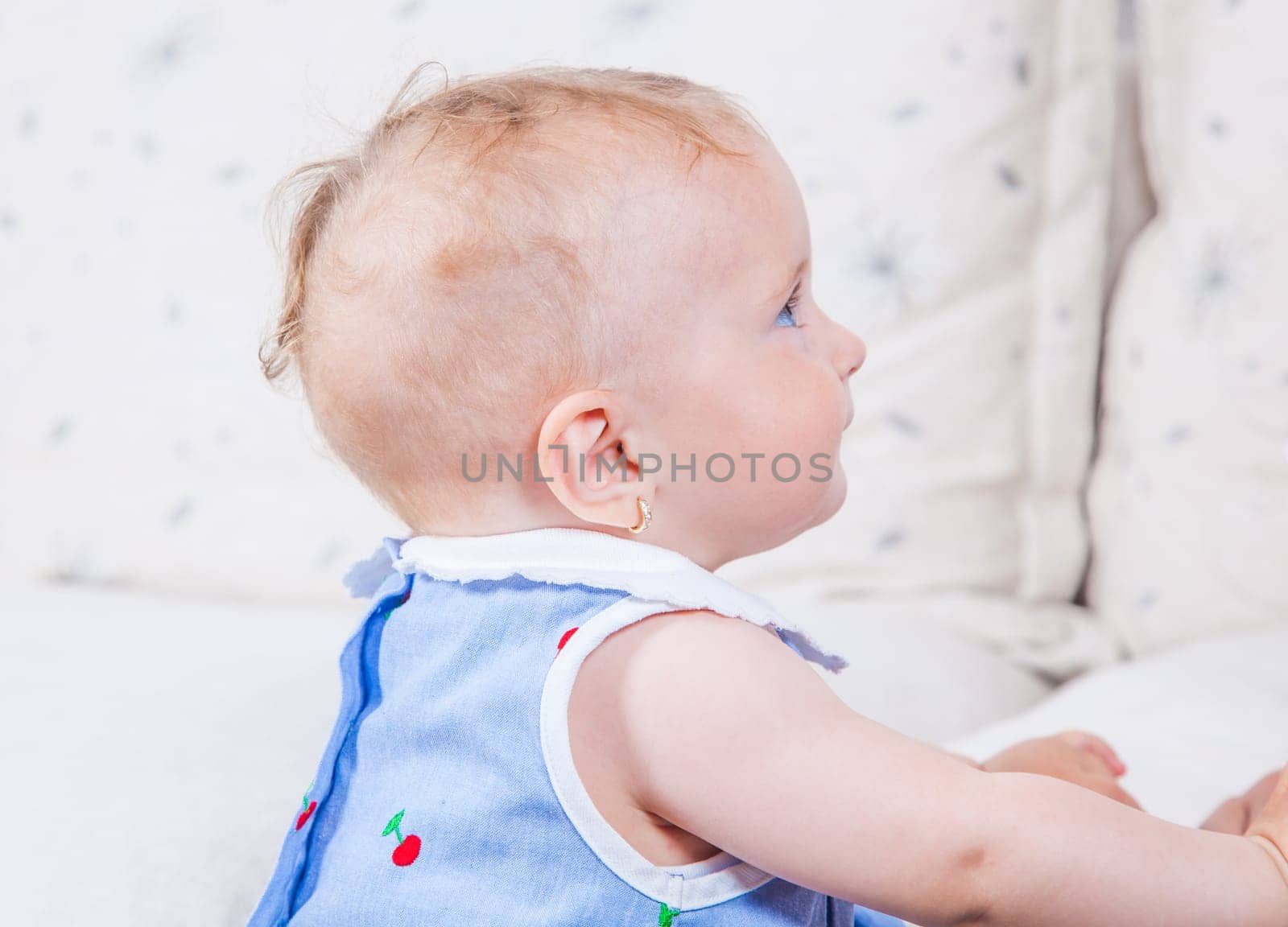 Portrait of 1 year old baby girl playing at home.