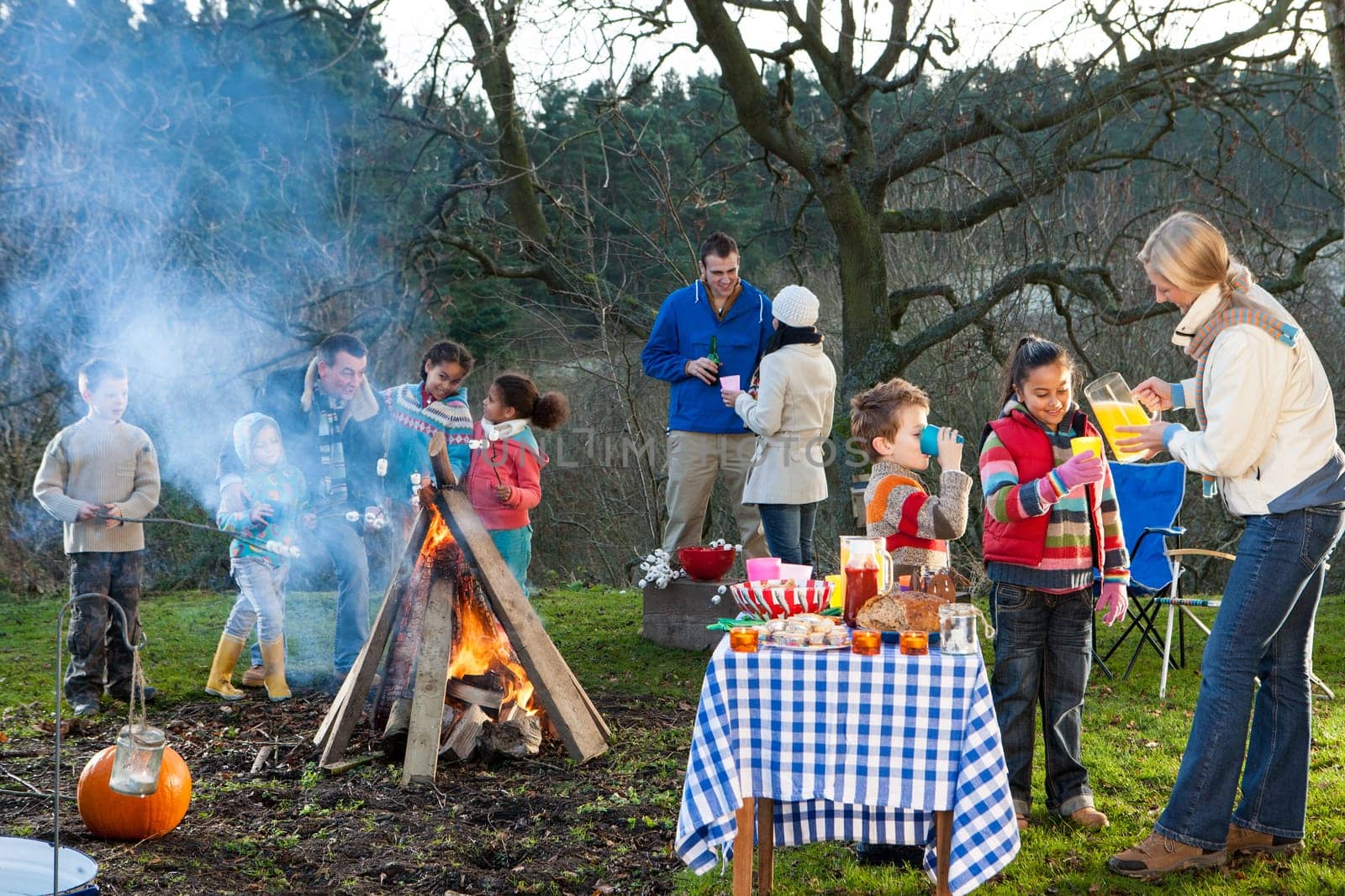 Family bonfire with food and drinks