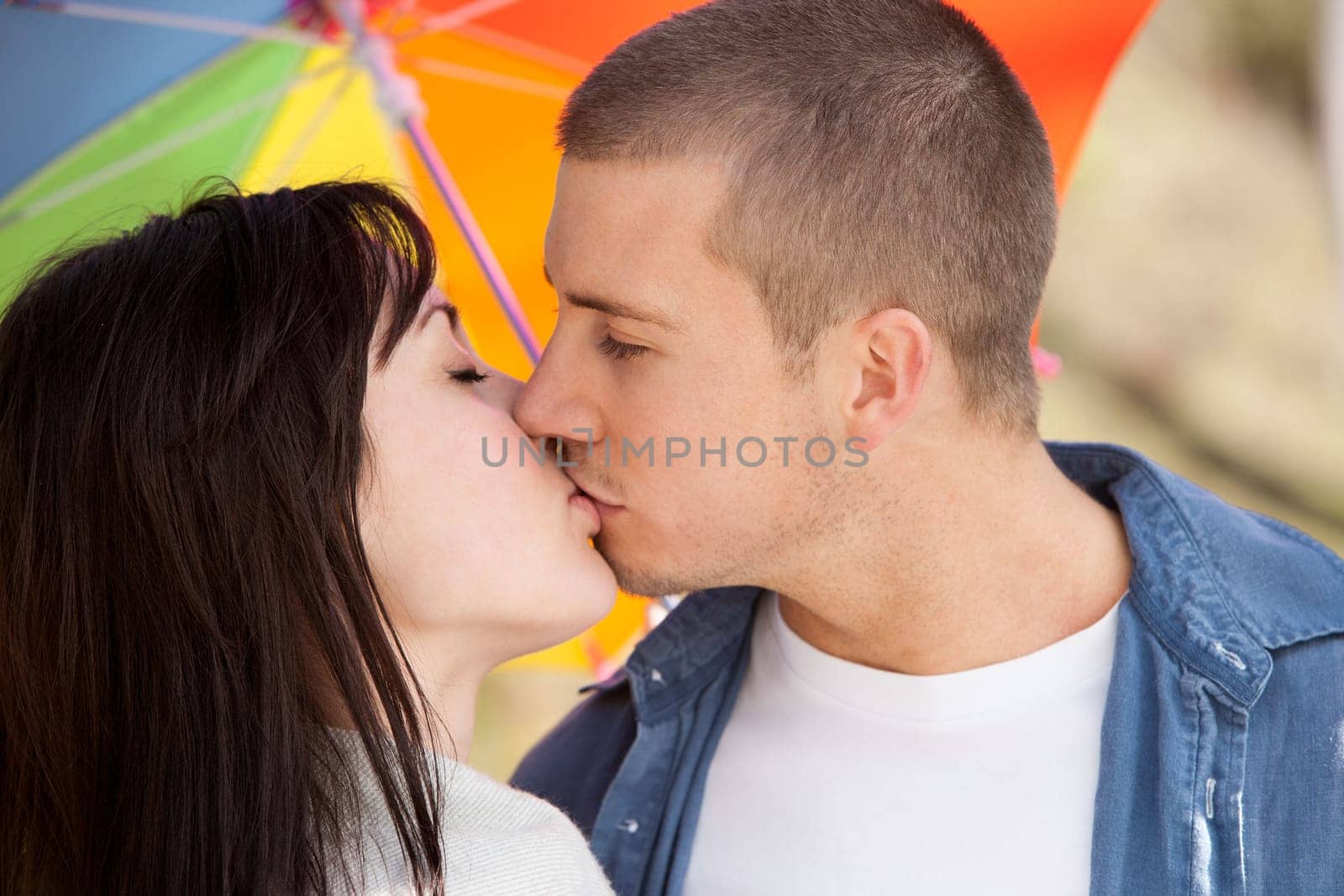 couple kissing outdoors