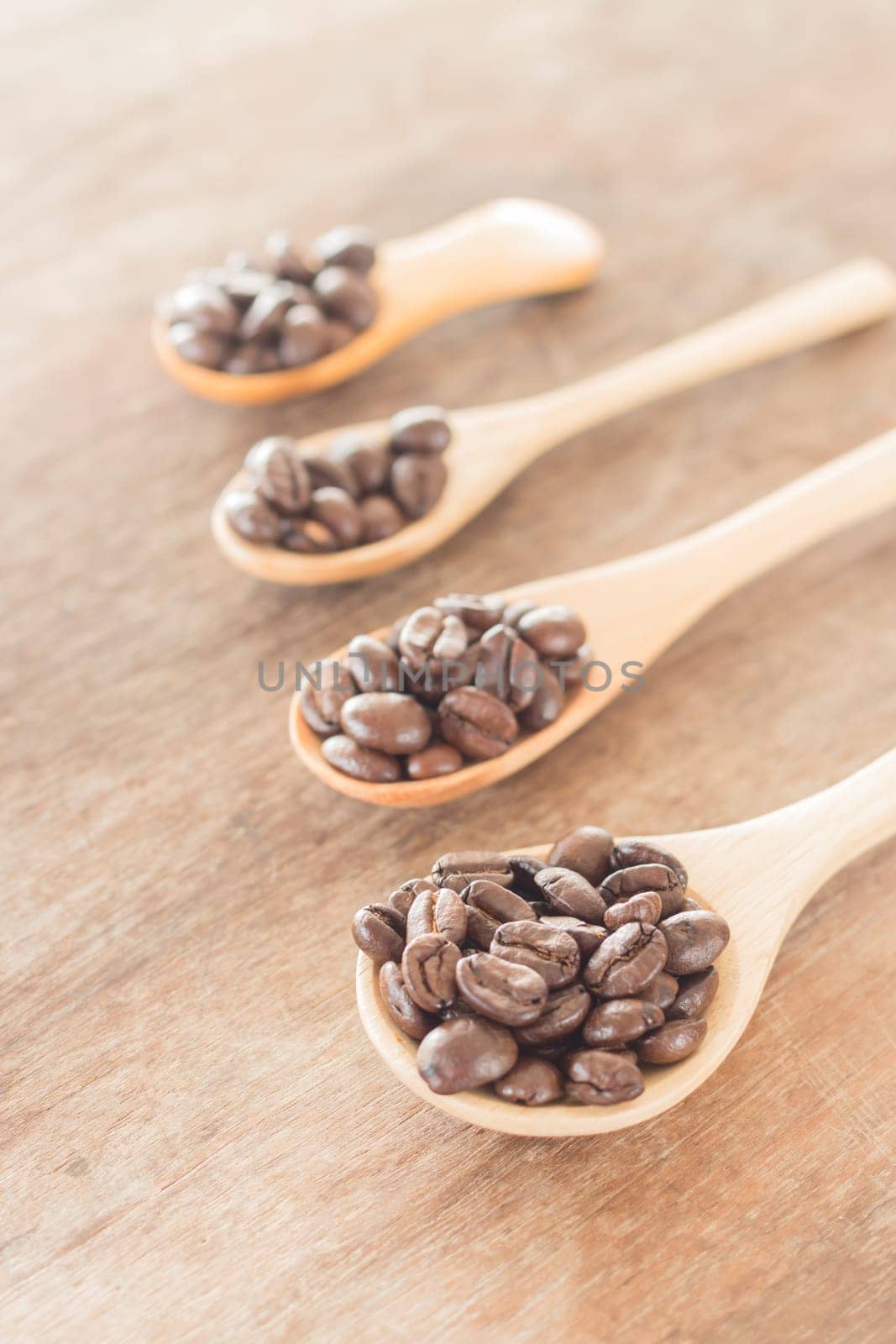 Coffee spoons on grunge wooden table, stock photo