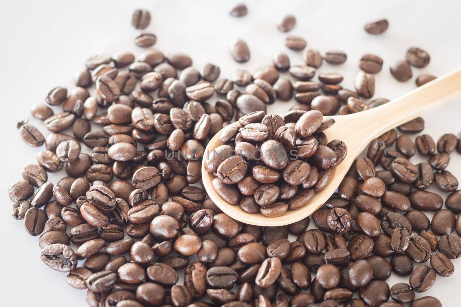 Spoon of roasted coffee bean, stock photo
