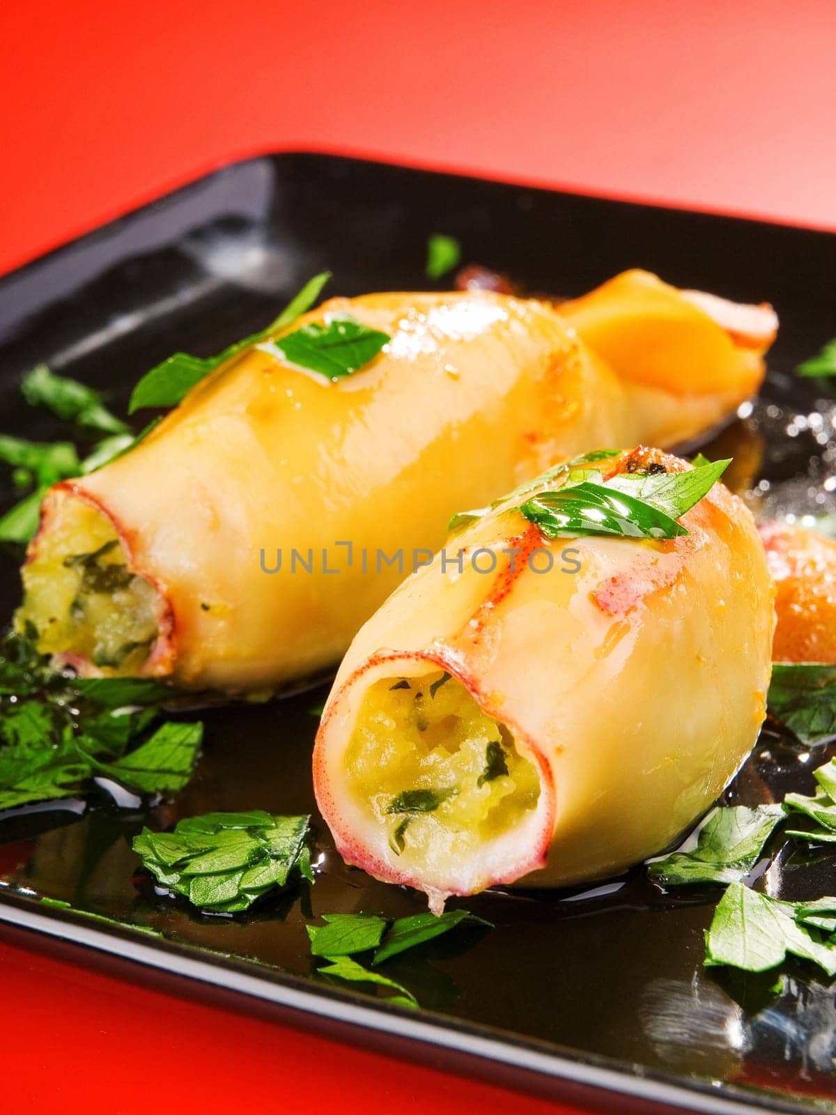 Stuffed squids with potatos and herbs