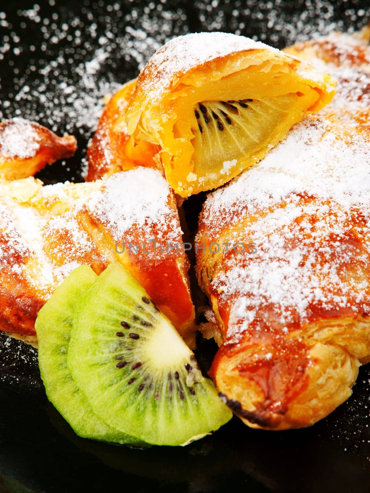 Croissants with kiwi fruit and caster sugar