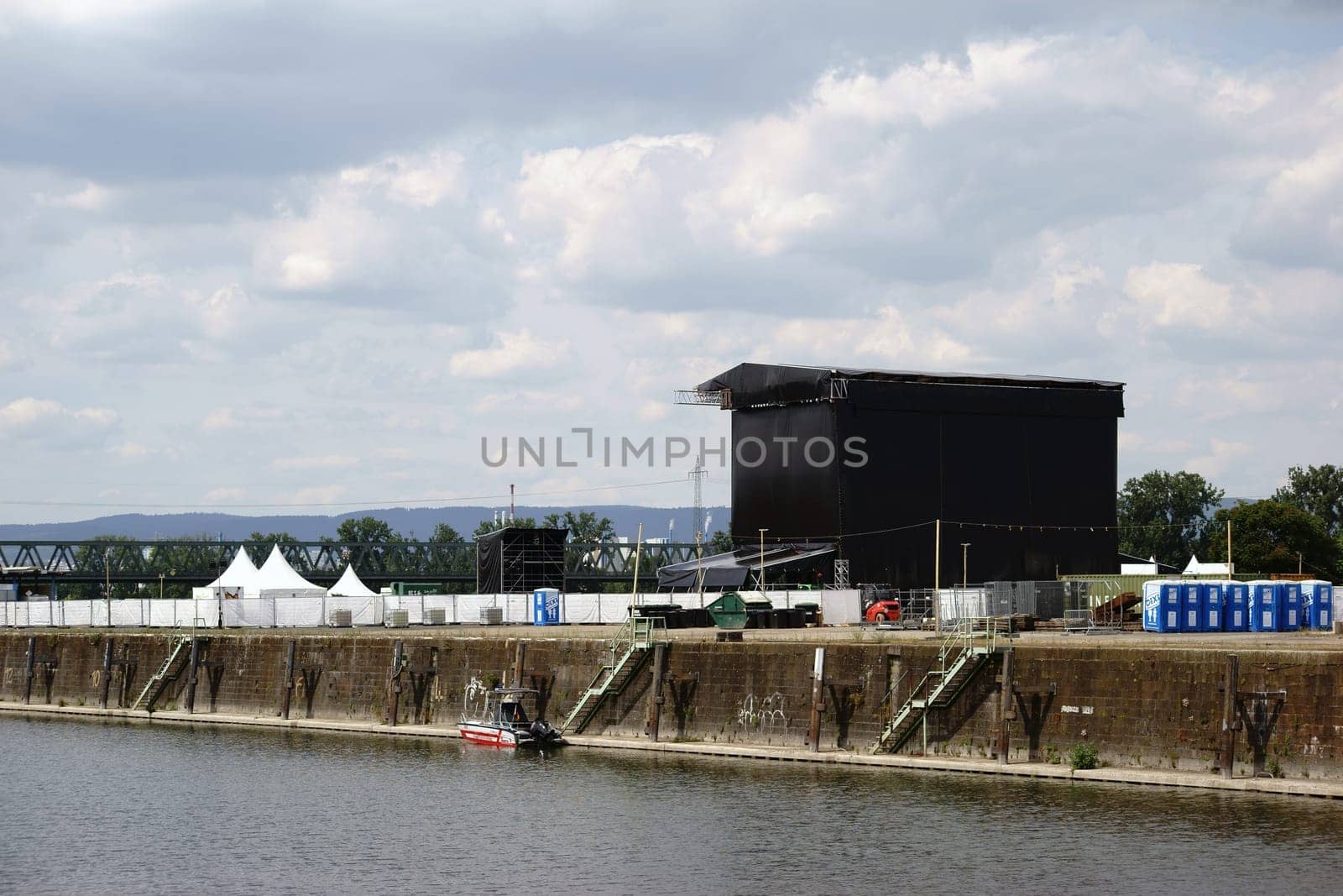 Mainz,Germany – June 24,2015: The cordoned-off stage and concert area Nordmole Zollhafen in Mainz with beer tents and Dixi toilets on June 24,2015 in Mainz.