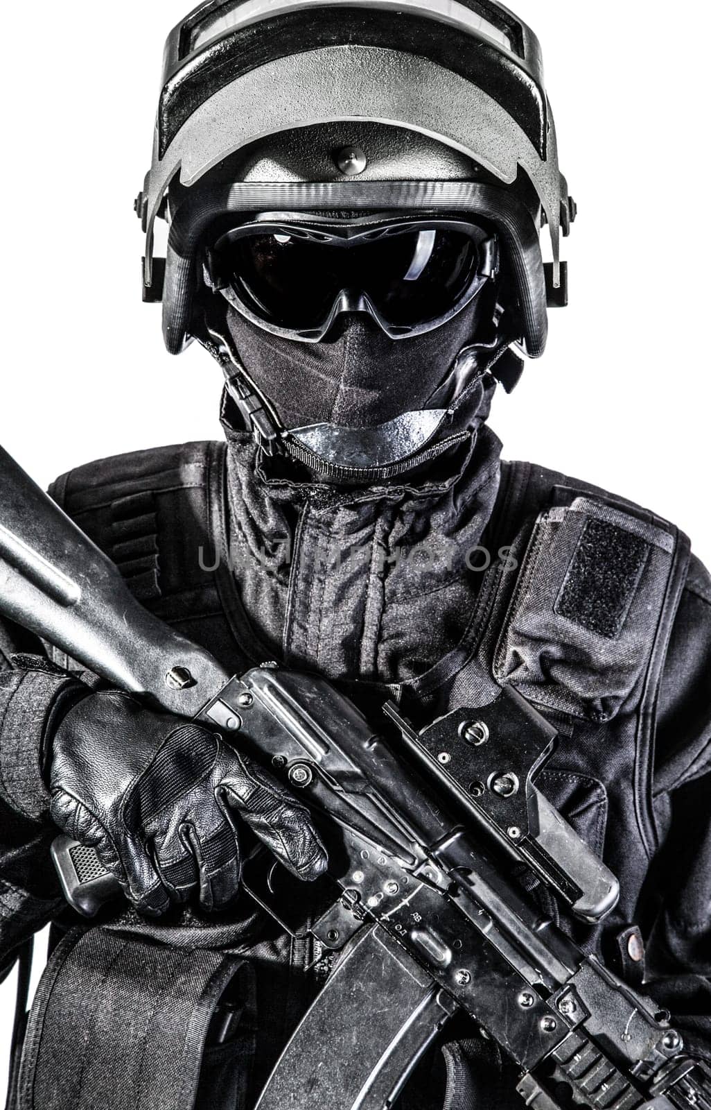 Russian special forces operator in black uniform and bulletproof helmet