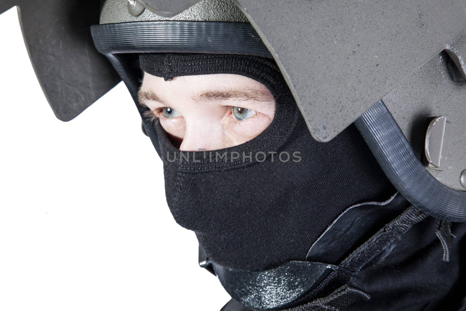 Russian special forces operator in black uniform and bulletproof helmet